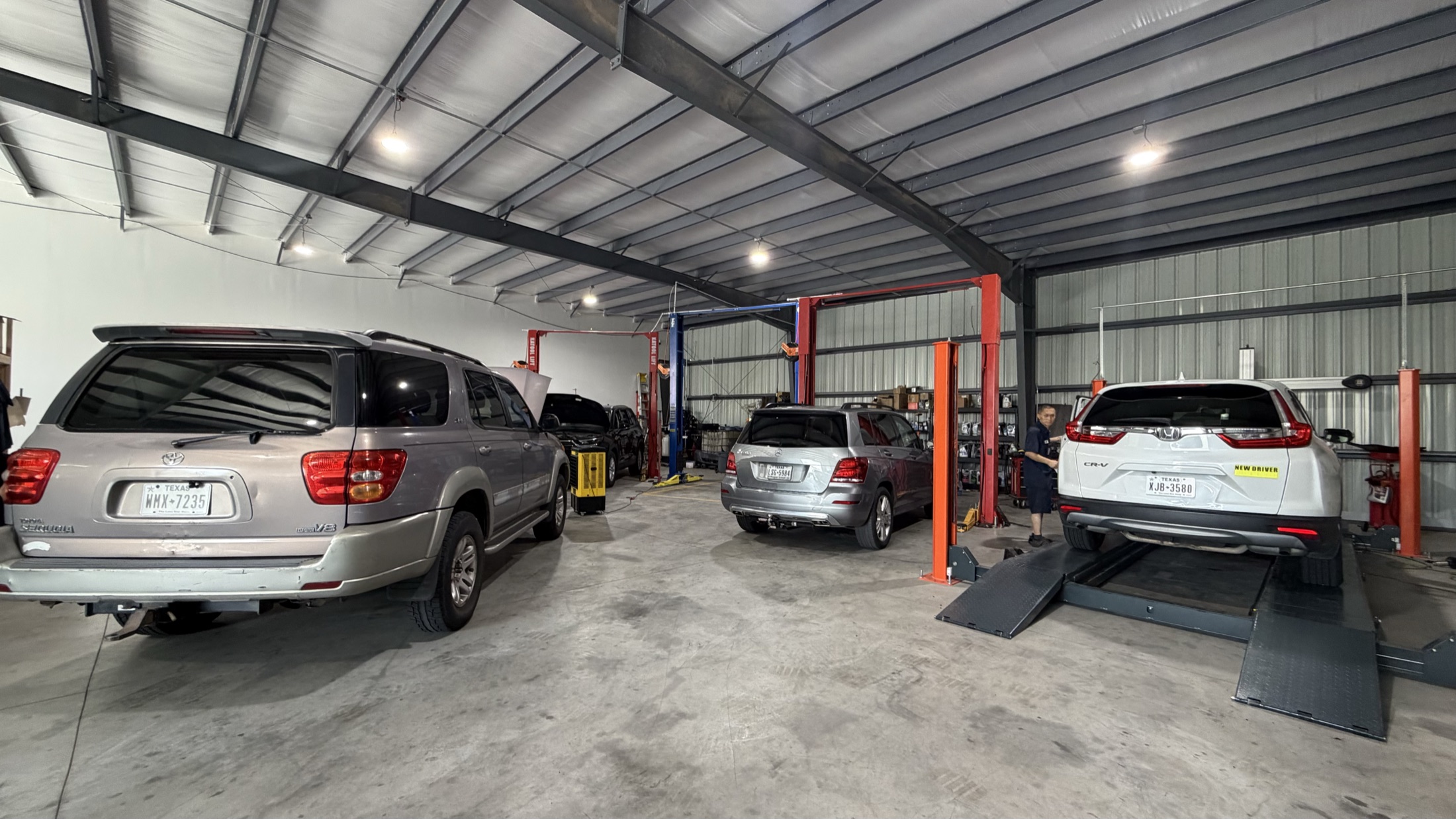 Service bays with vehicles on lifts