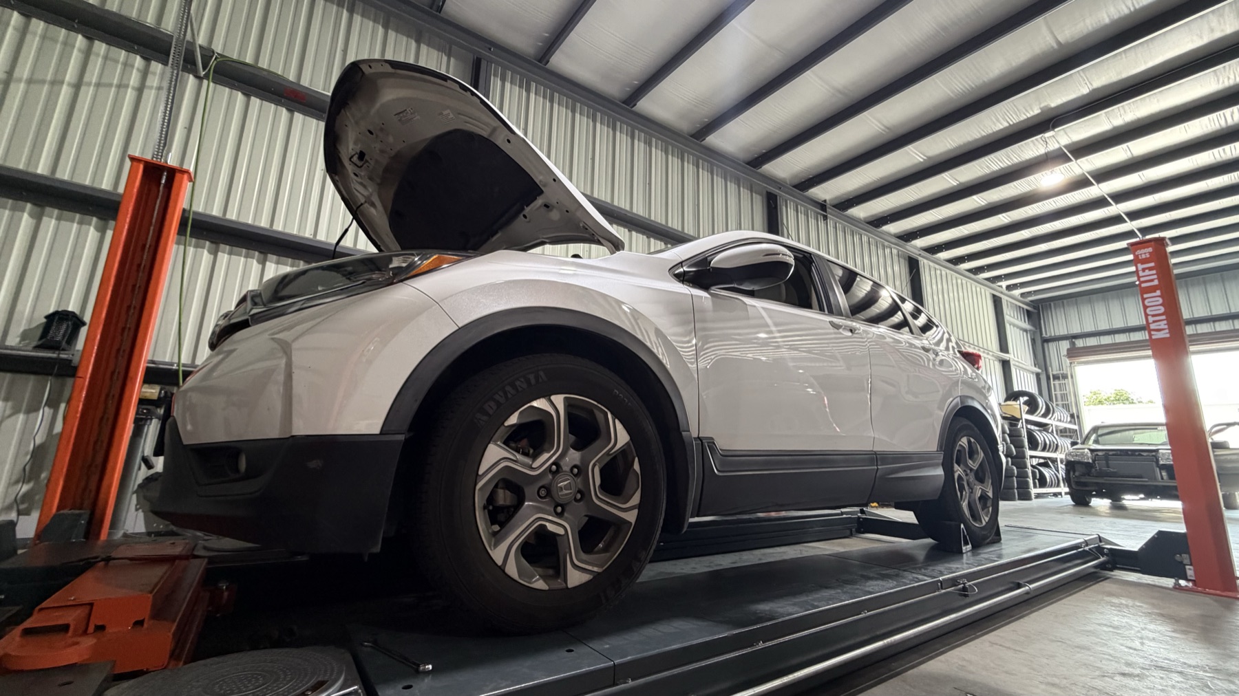 Honda SUV on alignment lift